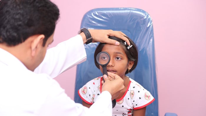 Little girl receiving eye care in India